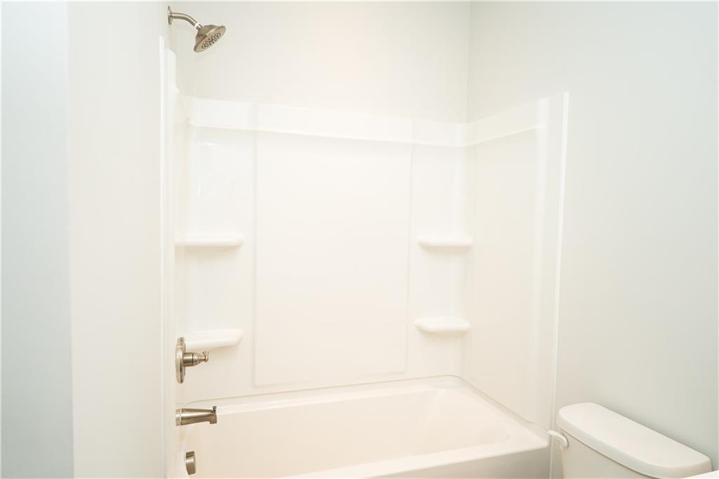 536 Sageton Court Grayson, GA 30017 - Photo 11 of 37 a bathroom with a bathtub and a toilet