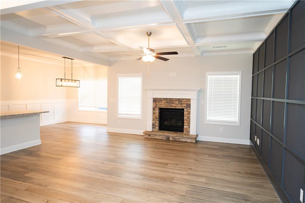 536 Sageton Court Grayson, GA 30017 - Photo 14 of 37 a view of a livingroom with wooden floor and a ceiling fan