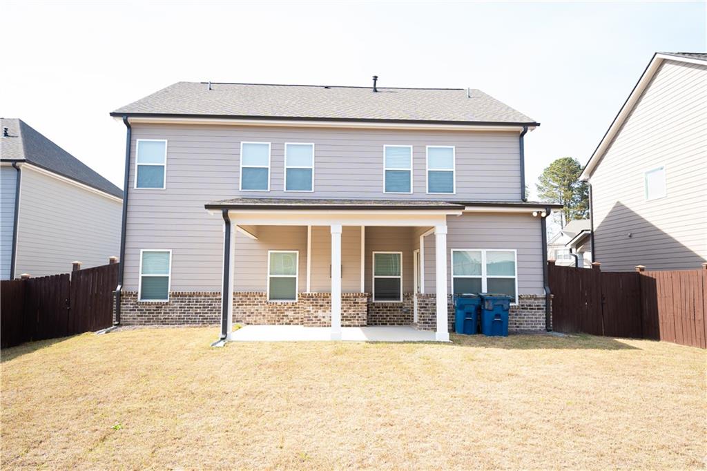 536 Sageton Court Grayson, GA 30017 - Photo 16 of 37 a view of a house with a backyard