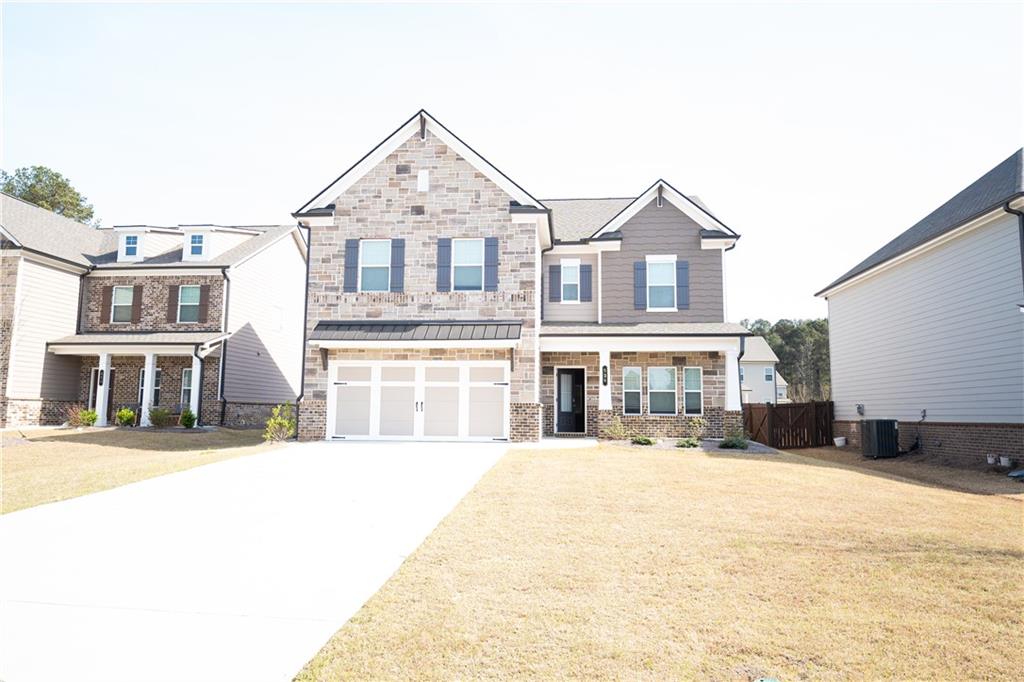 536 Sageton Court Grayson, GA 30017 - Photo 2 of 37 a front view of a house with a yard