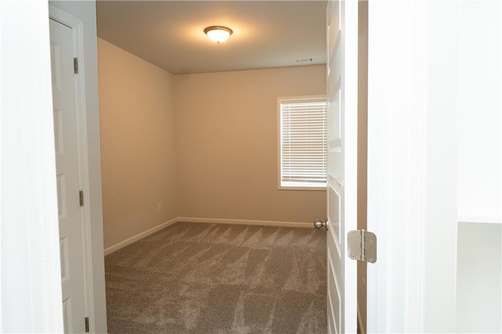536 Sageton Court Grayson, GA 30017 - Photo 26 of 37 a view of a small space with wooden floor and a window