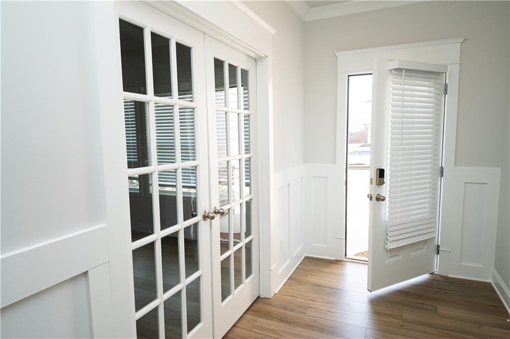 536 Sageton Court Grayson, GA 30017 - Photo 3 of 37 a view of a bedroom with wooden floor and white walls