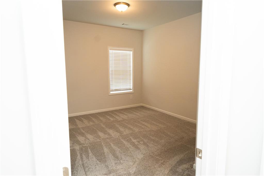 536 Sageton Court Grayson, GA 30017 - Photo 32 of 37 a view of an empty room with a window
