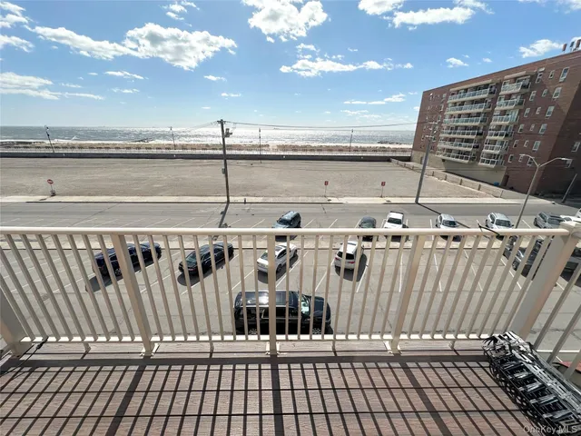 a spacious bathroom with a granite countertop sink toilet and shower