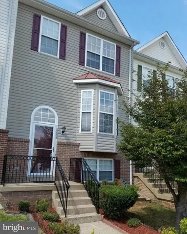 a front view of a house with glass windows