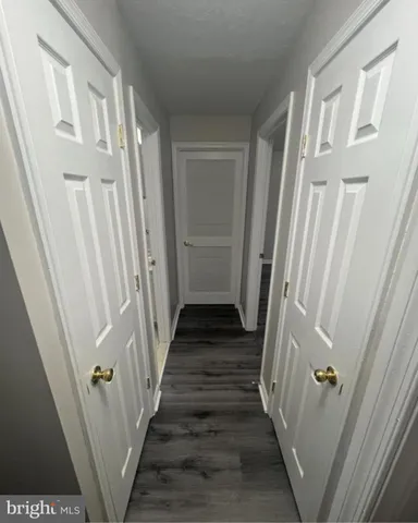 a view of a hallway with a door