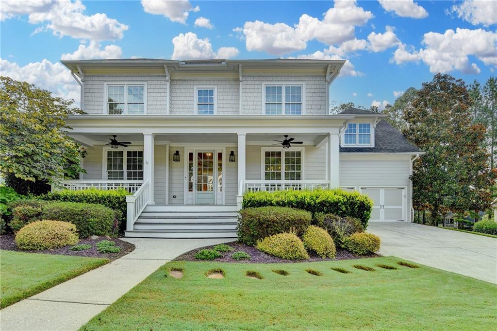 7051 Dove Point Lane Hoschton, GA 30548 - Photo 1 of 74 a front view of a house with a yard