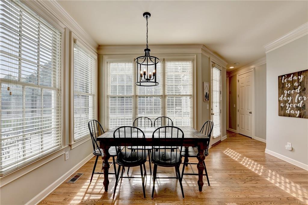 7051 Dove Point Lane Hoschton, GA 30548 - Photo 20 of 74 a view of a dining room with furniture window and outside view