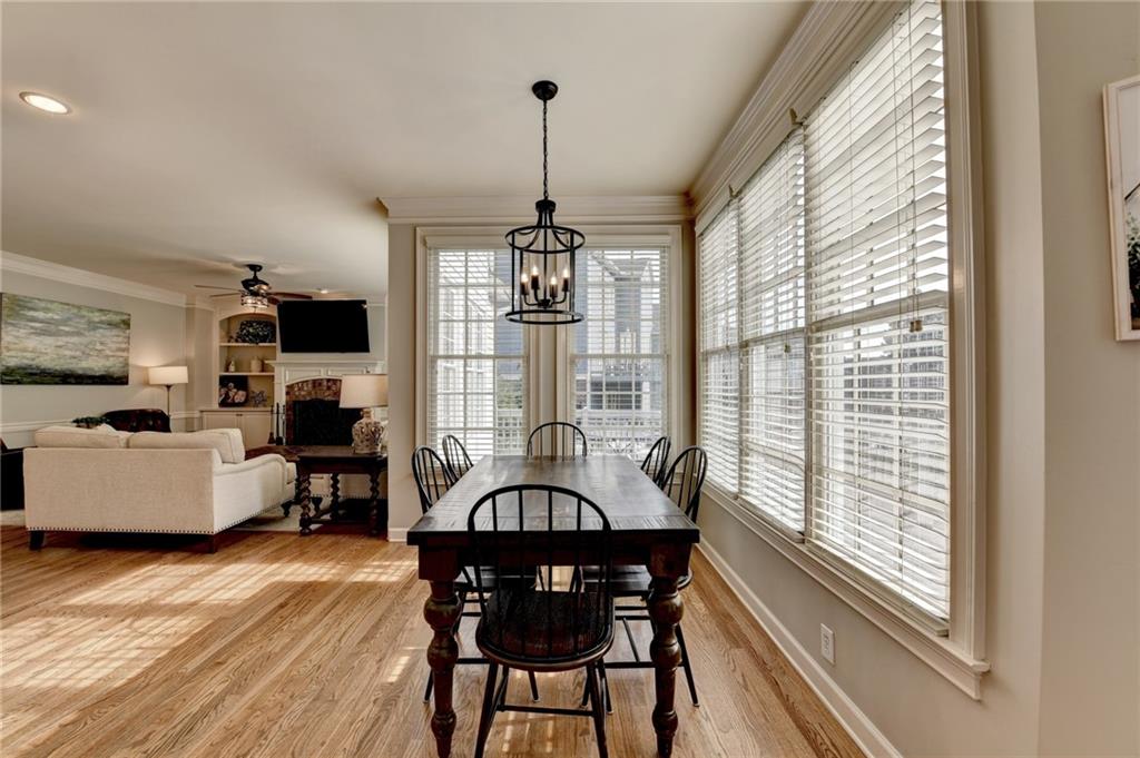 7051 Dove Point Lane Hoschton, GA 30548 - Photo 21 of 74 a view of a dining room with furniture window and wooden floor