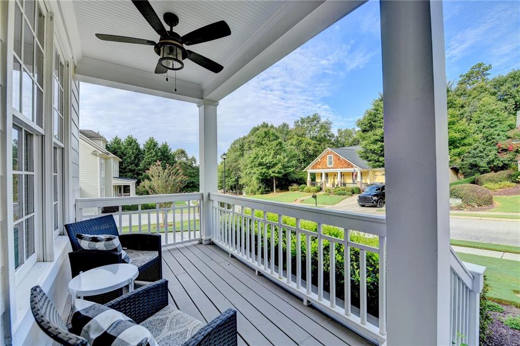 7051 Dove Point Lane Hoschton, GA 30548 - Photo 4 of 74 a view of a balcony with chairs