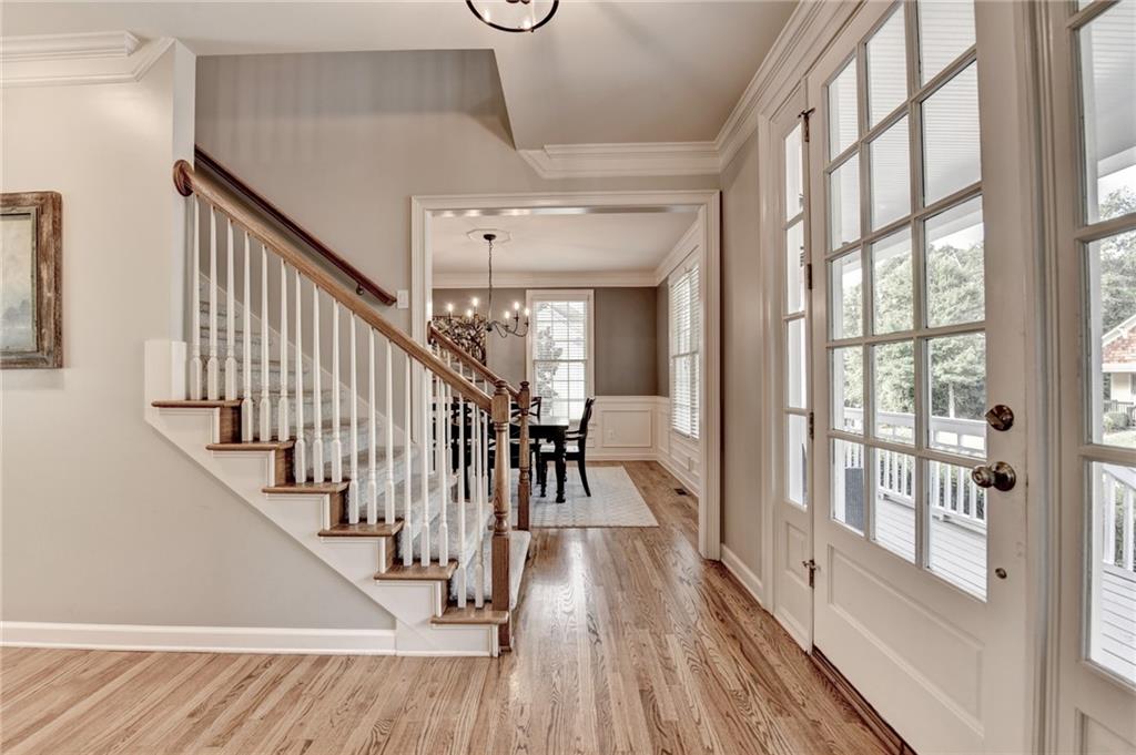 7051 Dove Point Lane Hoschton, GA 30548 - Photo 5 of 74 a view of entryway and hall with wooden floor