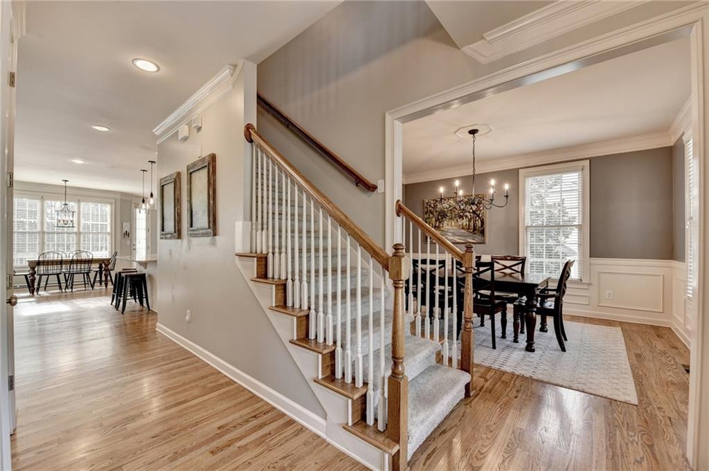 7051 Dove Point Lane Hoschton, GA 30548 - Photo 6 of 74 a view of dining room with wooden floor and windows