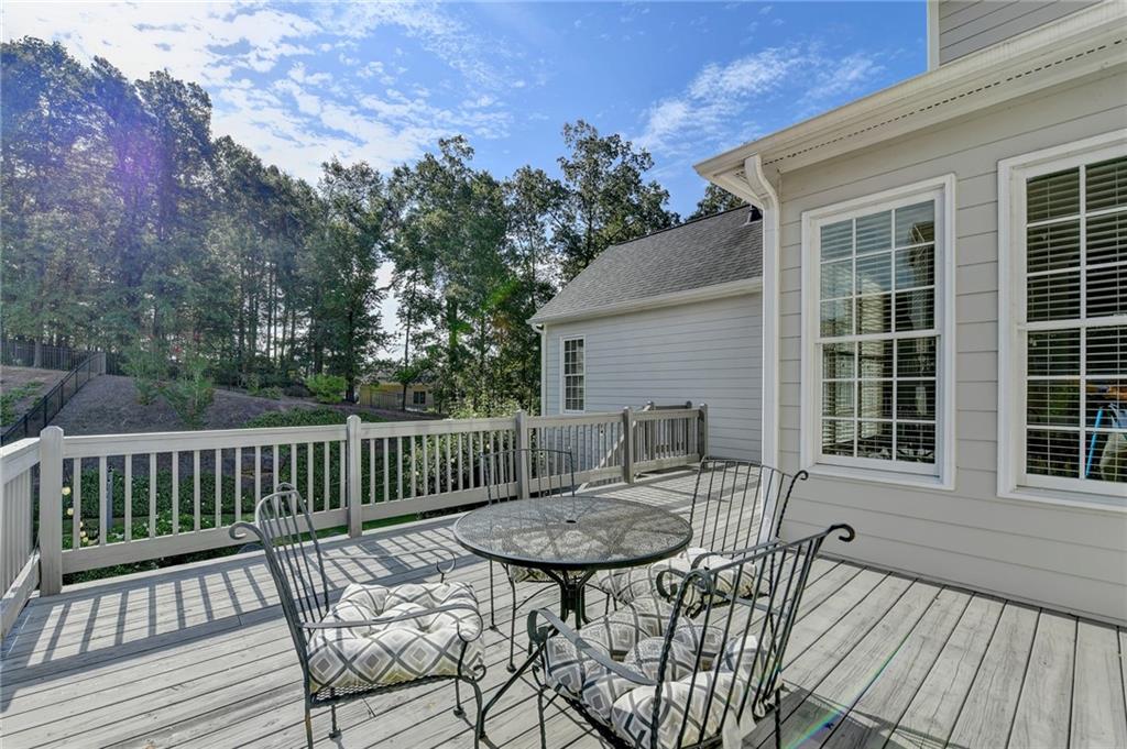 7051 Dove Point Lane Hoschton, GA 30548 - Photo 65 of 74 a view of a chair and table in the balcony