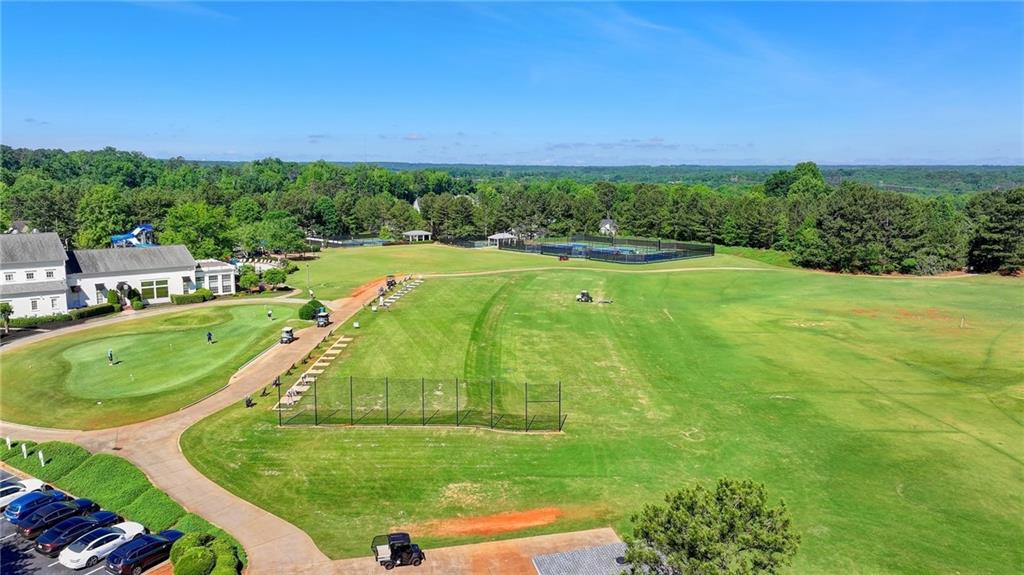 7051 Dove Point Lane Hoschton, GA 30548 - Photo 66 of 74 a view of a swimming pool and a yard