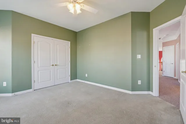 an empty room with closet area