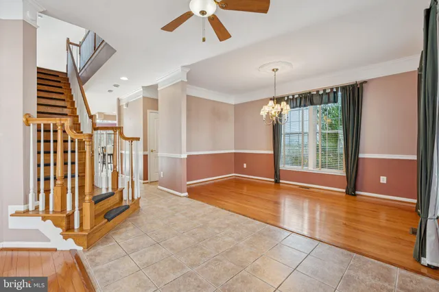 a view of an entryway with wooden floor and windows