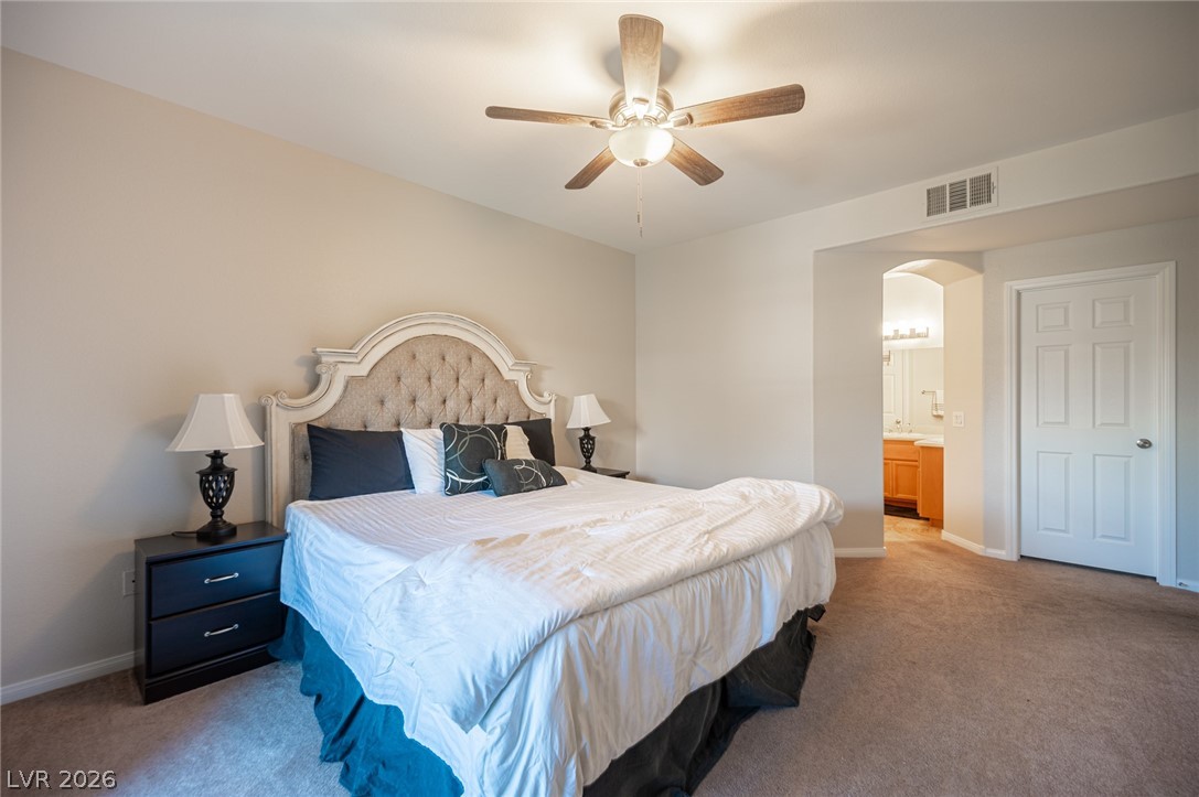 7701 West Robindale Road, Unit 274 Las Vegas, NV 89113 - Photo 29 of 38 This spacious bedroom offers comfortable living with direct access to a private bathroom.