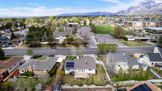 1822 East 9800th Street South Sandy, UT 84092 - Photo 12 of 38 Aerial perspective of suburban area with a mountain backdrop