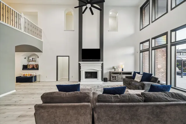 a living room with fireplace furniture and a flat screen tv
