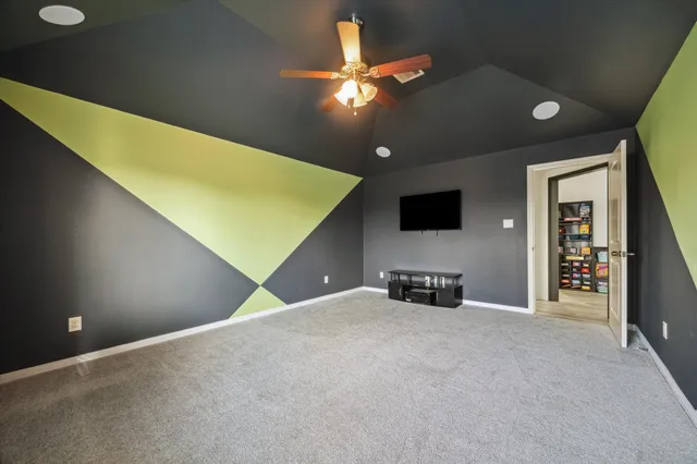 a view of an empty room with a flat screen tv