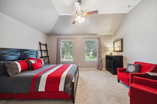 a bedroom with a bed and a couch