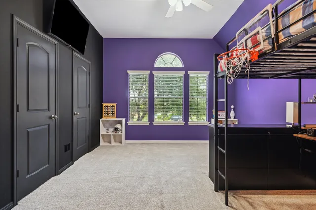 a spacious bathroom with a bathtub and shower