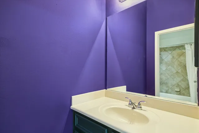 a bathroom with a sink and a mirror