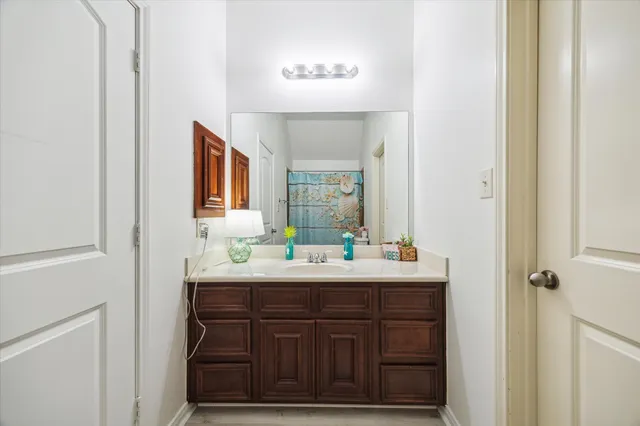 a bathroom with a sink and a mirror