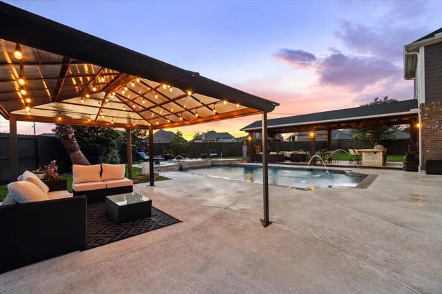 a view of a swimming pool and lounge chair