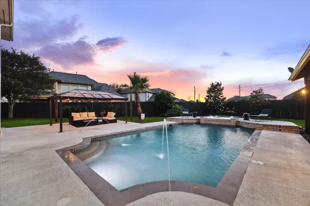 a view of a patio with couches and chairs