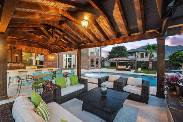 a swimming pool with outdoor seating