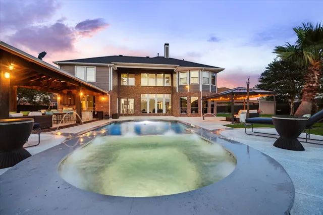 a view of swimming pool with outdoor seating