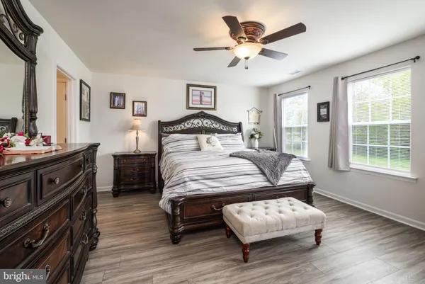 a bedroom with a bed and a dresser