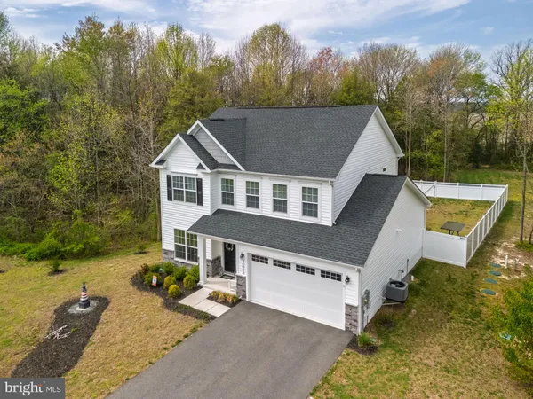 a aerial view of a house with a yard