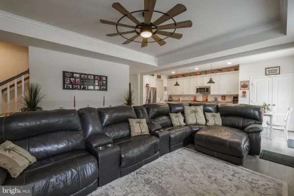 a project room with furniture and a chandelier