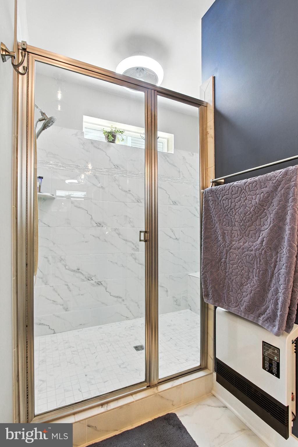 33 Tulip Tree Way Gettysburg, PA 17325 - Photo 16 of 34 a bathroom with a glass shower door and a glass door