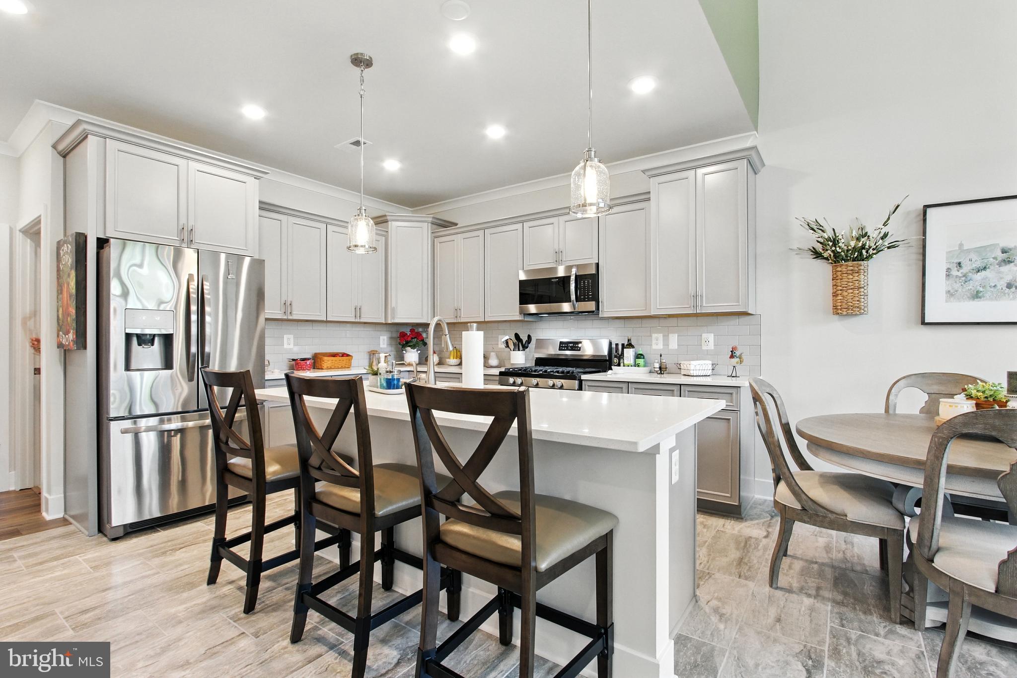33 Tulip Tree Way Gettysburg, PA 17325 - Photo 4 of 34 a kitchen with kitchen island appliances cabinets and furniture