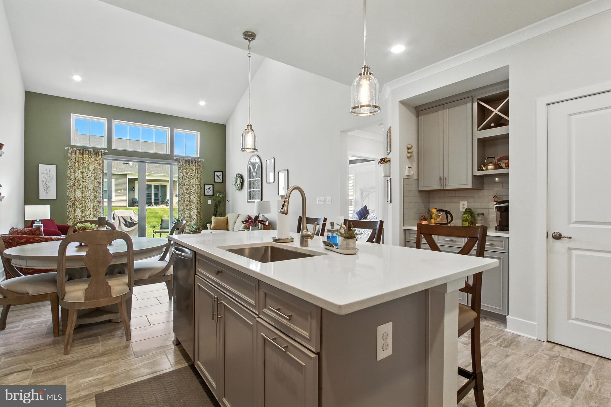 33 Tulip Tree Way Gettysburg, PA 17325 - Photo 9 of 34 a kitchen with a sink a stove and chairs