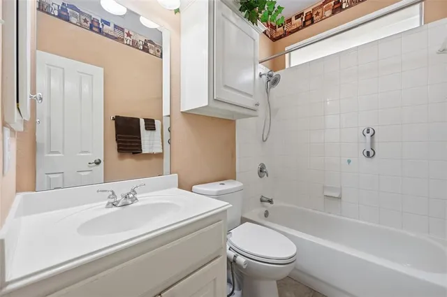 a bathroom with a sink a toilet and a bathtub