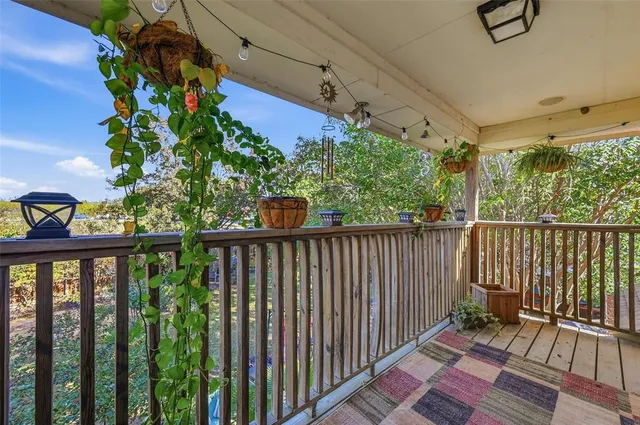 a balcony with wooden floor