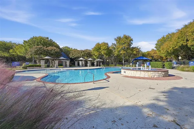 a view of swimming pool with a yard