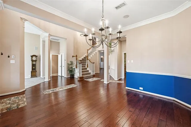 a view of a livingroom with wooden floor