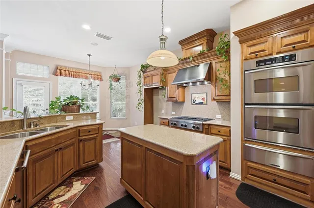 a kitchen with a stove and a microwave