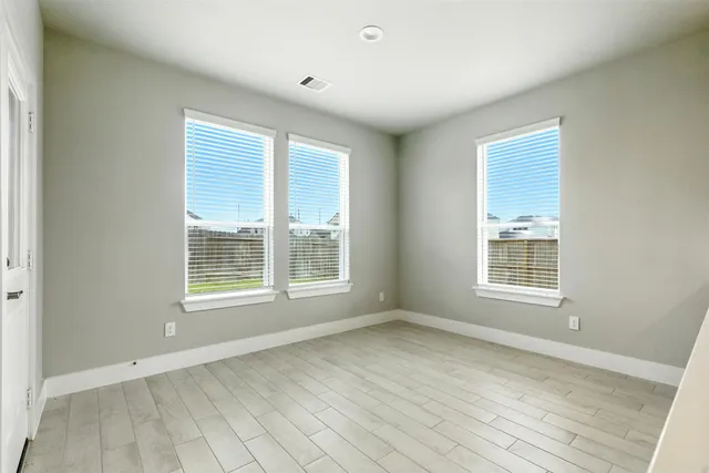 a spacious bathroom with a double vanity sink and a mirror
