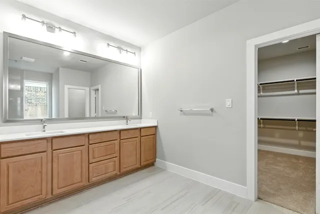 a bathroom with a shower and a glass door