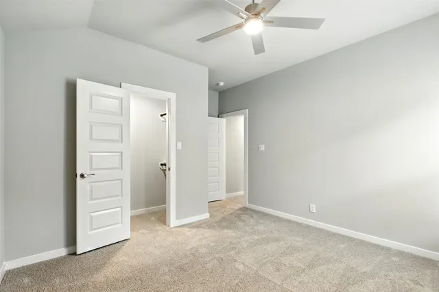 a view of a house with backyard and garden