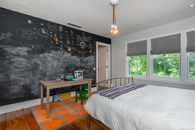 a living room with furniture window and wooden floor