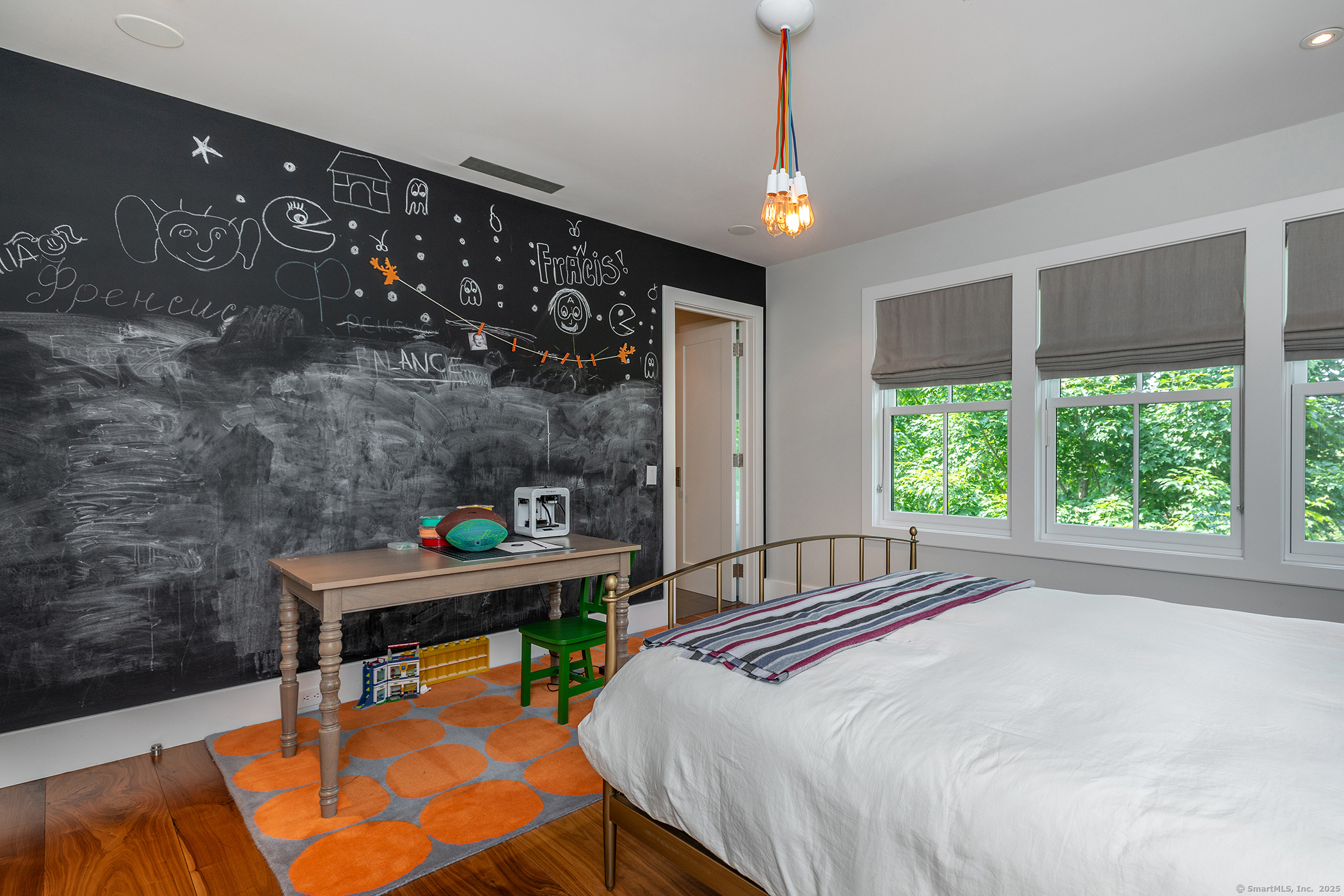 85 West Church Hill Road Washington, CT 06794 - Photo 24 of 38 a bedroom with a bed and a chandelier