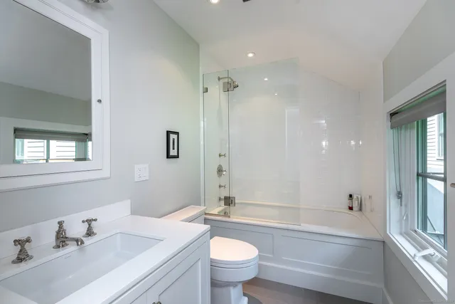 a room with gym equipment and a flat screen tv