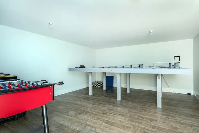 a living room with furniture cabinets and window